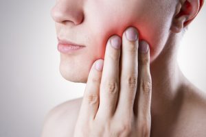 Pain from growing wisdom tooth