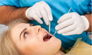 young woman preparing for emergency tooth removal